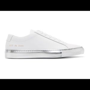 White common projects with silver soles. Worn but in good condition.